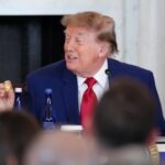 Donald Trump holds up a gold replica of a deep sea nodule given to him at a mining industry event earlier this month.