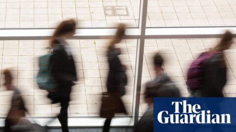 Secondary school students walking down a corridor