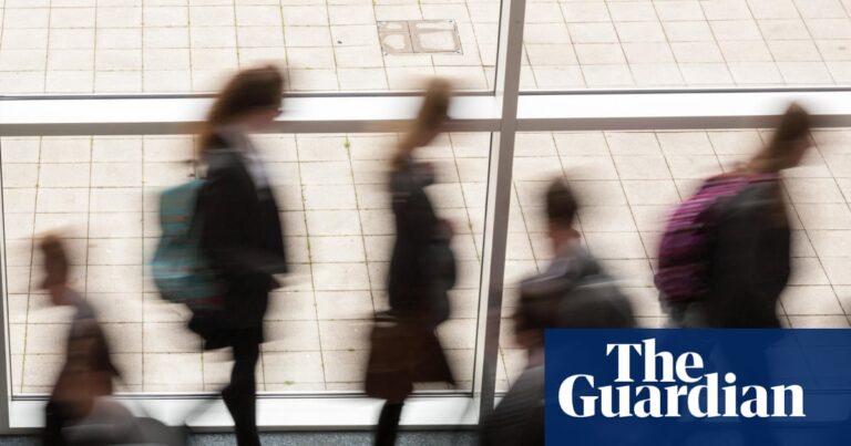 Secondary school students walking down a corridor