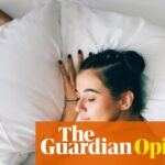 young woman sleeping in bed