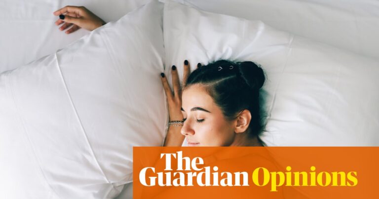 young woman sleeping in bed