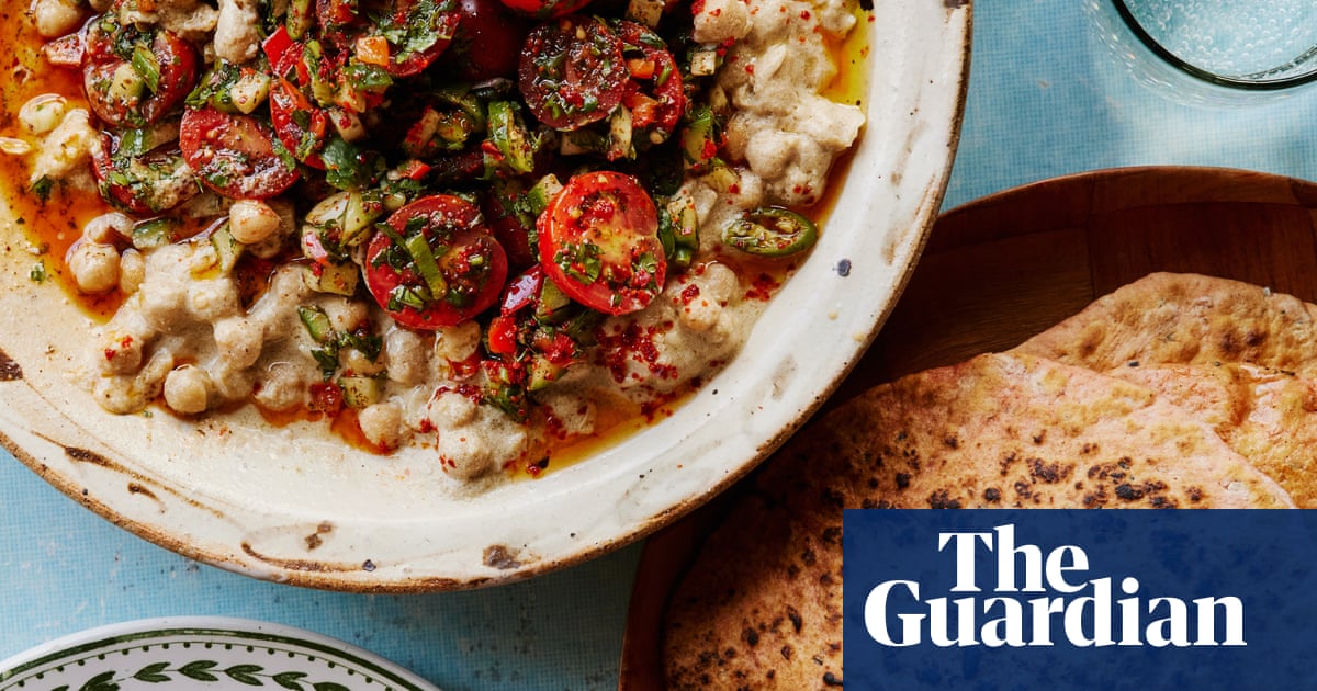 Sami Tamimi’s musabaha, or warm chickpeas with spicy cherry tomato and coriander salad.