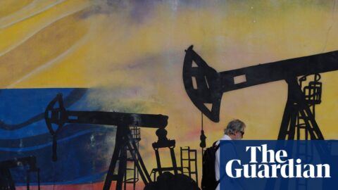 Man walks past mural