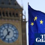 An EU flag flies in the wind outside Big Ben in London
