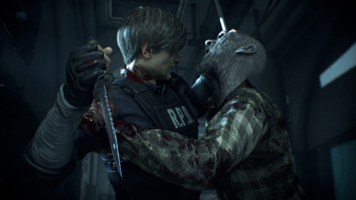 RE2 protagonist Leon Kennedy attempts to fend off a zombie with his combat knife.