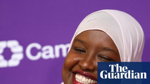 Sagal Abdi-Wali smiles in a pink hijab and blazer after her by-election win