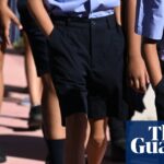 NSW schoolchildren in uniform walk in a line on the first day of term
