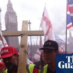 Rally crowd holds a wooden cross and Union Jack flags near Big Ben in London