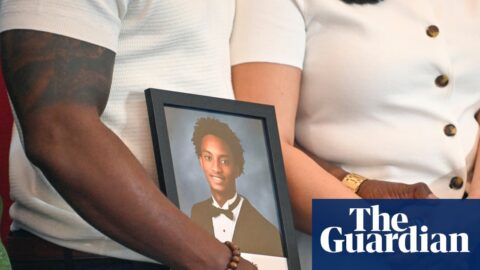 People hold picture of teenager