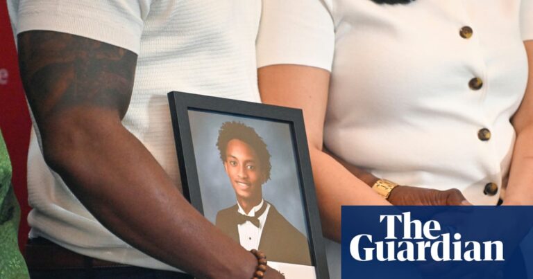 People hold picture of teenager